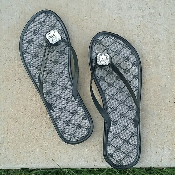 Black flip flops with jewel embellishment