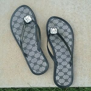 Black flip flops with jewel embellishment