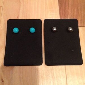 Black and blue pairs of studs.