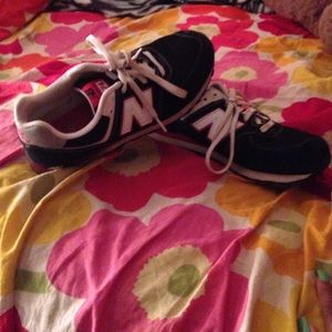 Black, red, and gray New Balance Sneakers