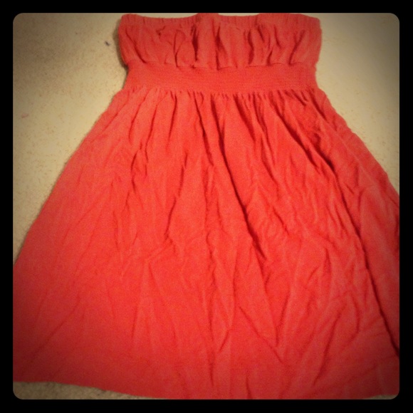 Strapless top that is Burnt orange.
