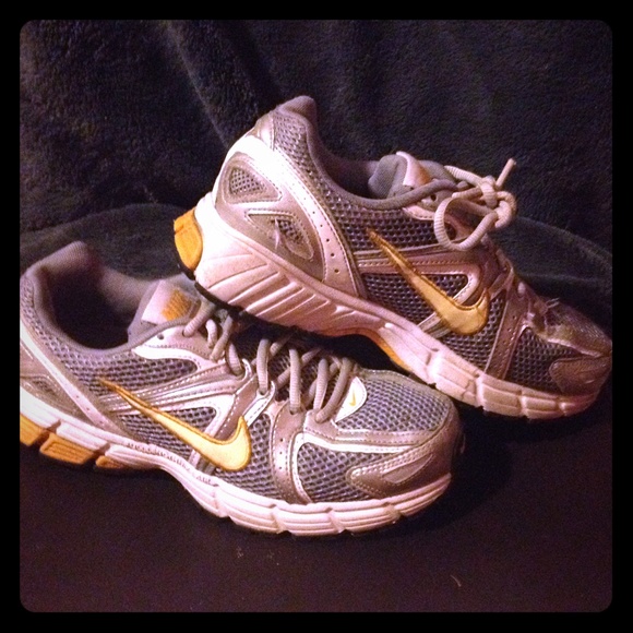 Silver/gray Nike running sneakers