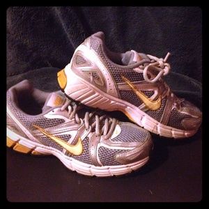 Silver/gray Nike running sneakers