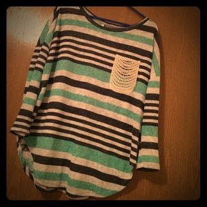 Quarter sleeved, striped top with lace pocket.