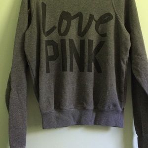 A pink vs over shoulder sweater