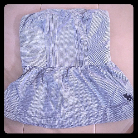 Strapless navy blue and white patterned top.