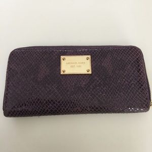 Michael Kors purple snake skin zip wallet on sale