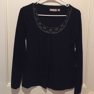 black long sleeve top with embellishments on top