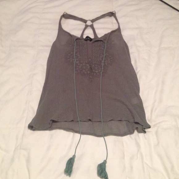 Pale green ribbed tank top with hanging tassles!