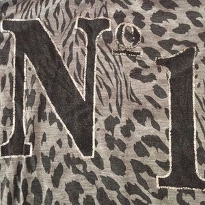 Cheetah print shirt.