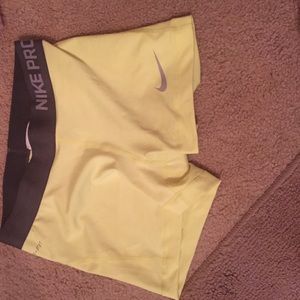 Bright yellow and grey Nike pro spandex