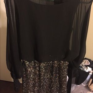 An AGACI sequined black dress