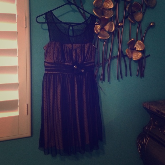 Black pattern dress with flowers in the front. New