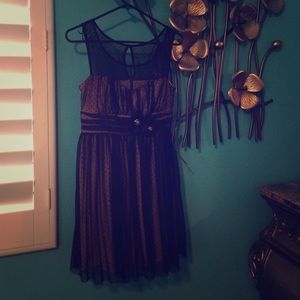 Black pattern dress with flowers in the front. New