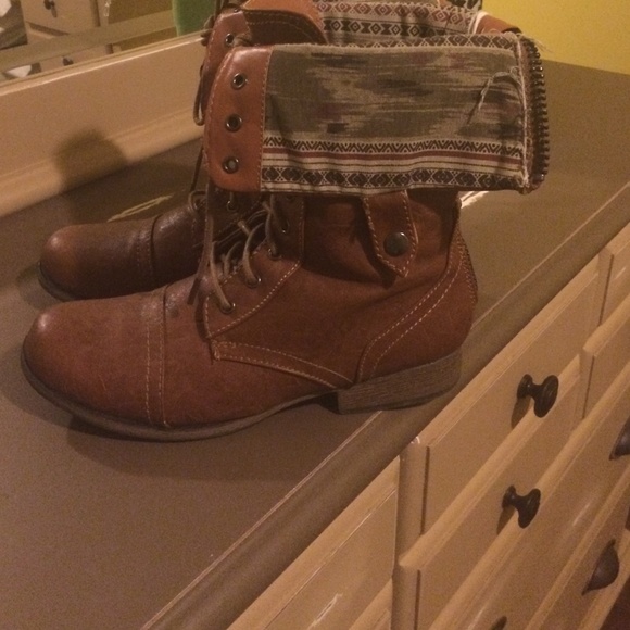Brown leather combat boots.