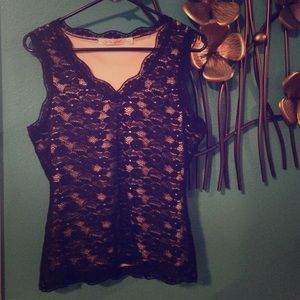 Sleeveless black flower net top with nude inner