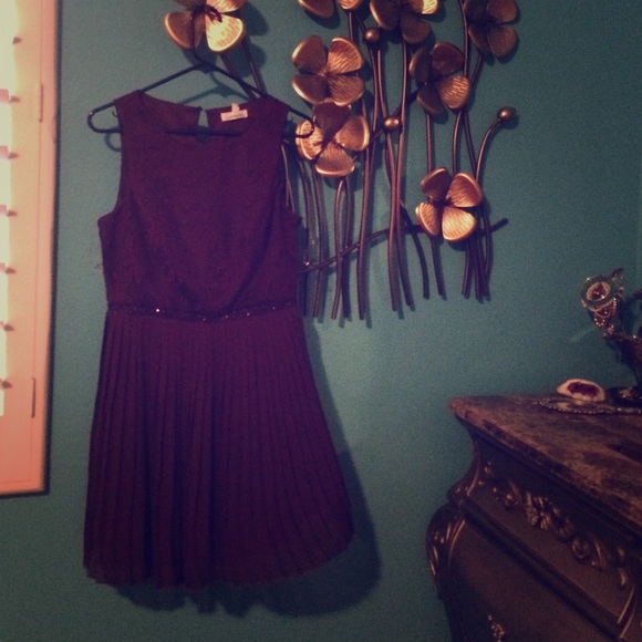 Purple dress knee-length. New.