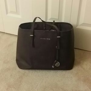 MK jet set travel purple staffiano leather tote.