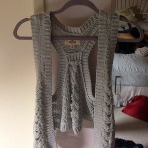 A sleeveless cardigan