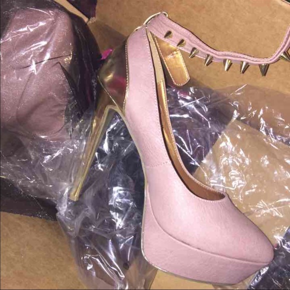 Dusty rose/pink (semi-round) pointed-toe pumps.