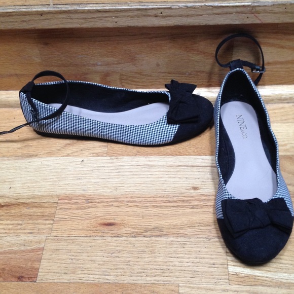 Black and white flats with ankle strap