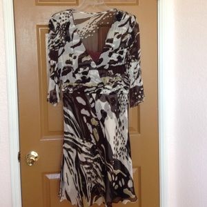 A brown and cream printed 3/4 sleeve dress.