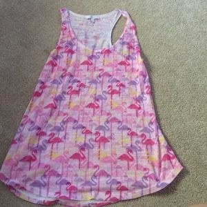 A light pink background flamingo tank top.