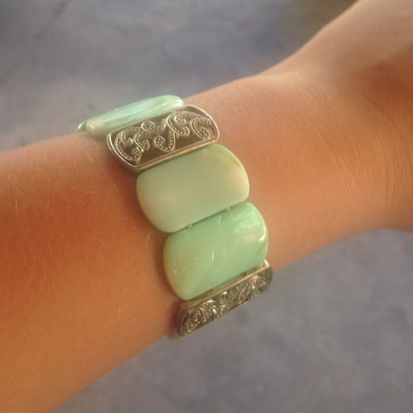 Blue rectangular bracelet with metal swirls