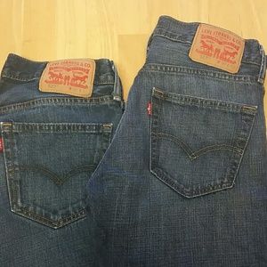 Three pairs of Levi's jeans.