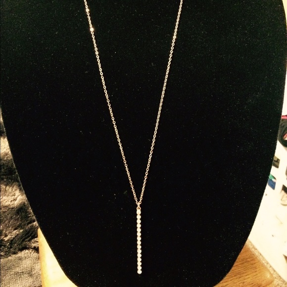 Long gold-toned w crystals inlaid in a gold bar - Picture 2 of 2