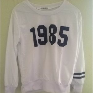 White 1985 varsity sweatshirt