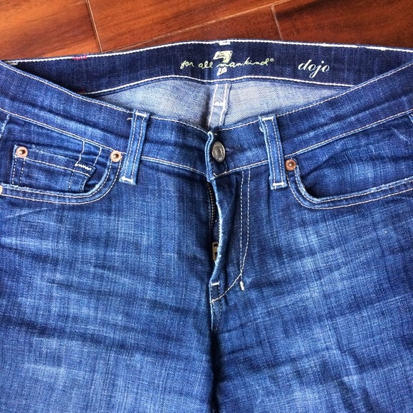 2 pairs of Seven Dojo bootcut blue jeans.