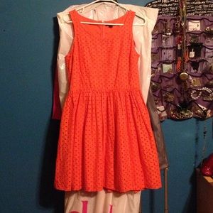 Orange a-line eyelet dress.