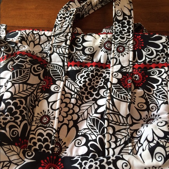 Diaper bag with changing pad and wipe holder