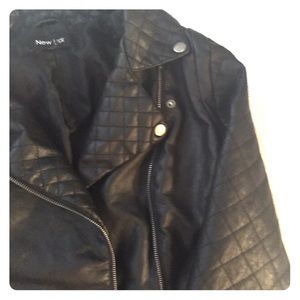 Leather jacket with quilted sleeves