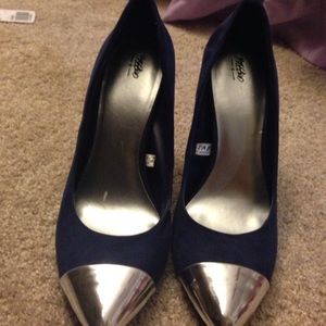 Silver toed, navy high heels
