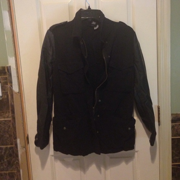Black polyester jacket with leather sleeves