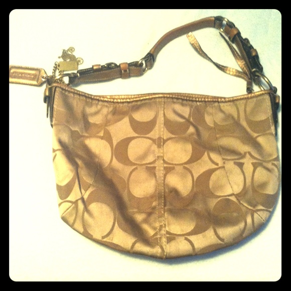 Throwback coach over the shoulder purse.
