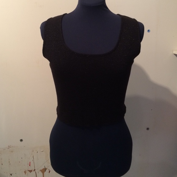 Black sweater tank with metallic stripe.