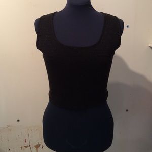 Black sweater tank with metallic stripe.