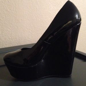 Black Patent Wedge Pumps.