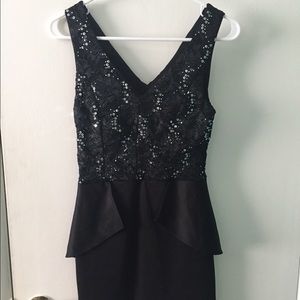 Short black peplum dress