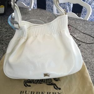 White patent leather Burberry handbag.
