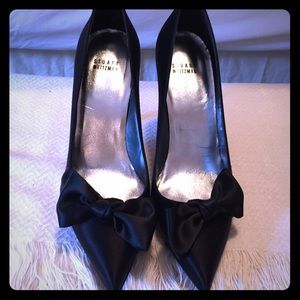 Black satin bow pumps