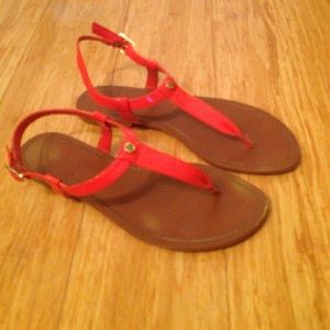 Reddish-orange strapped sandals