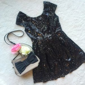 Black sequin cap-sleeve dress