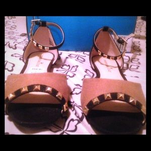 Tan with black sandals with gold studs