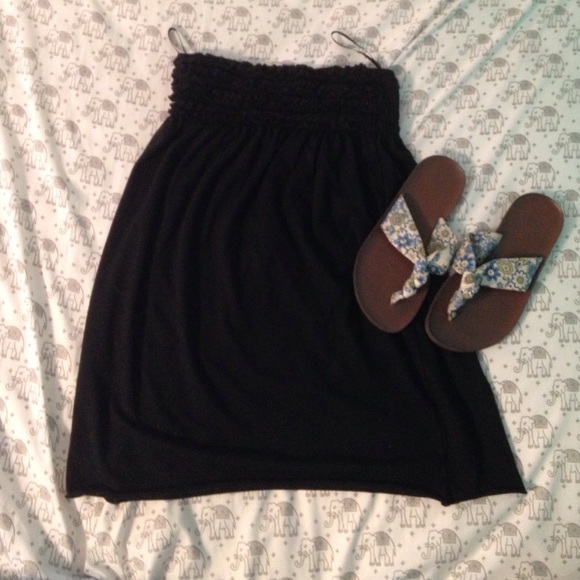 A swim suit cover up and flip flops.