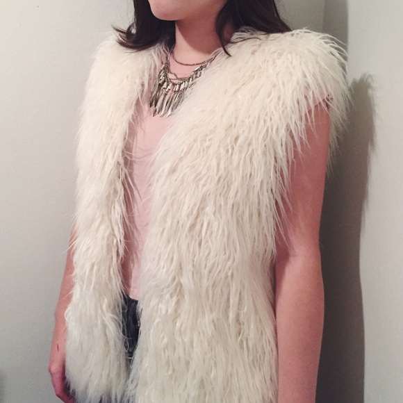 white fuzzy vest
