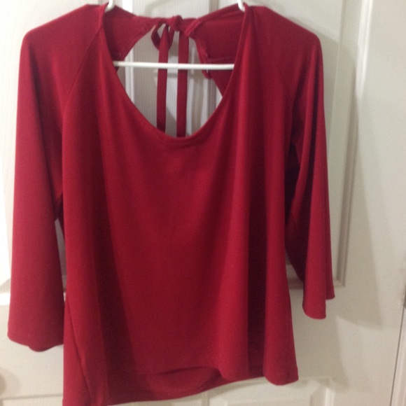 Red top with scooping back with a bow
